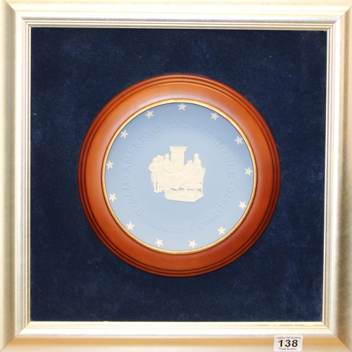 138 - A Wedgwood 'American Independence' Jasperware plate mounted as a plaque on blue velvet background in... 