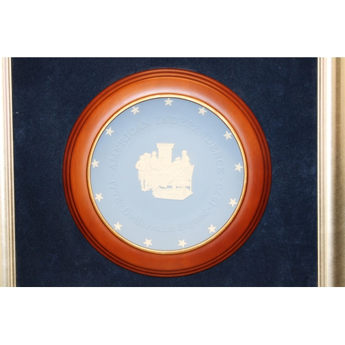 138 - A Wedgwood 'American Independence' Jasperware plate mounted as a plaque on blue velvet background in... 