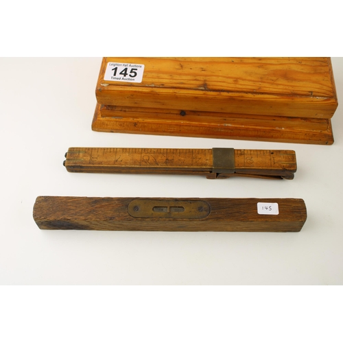 145 - An early treen shoe / foot measure together with a spirit level and a cased wet stone. (3)