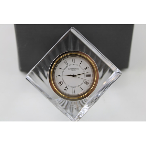 150 - A boxed Waterford Crystal desk clock. Quartz movement. Height 9.5cm.