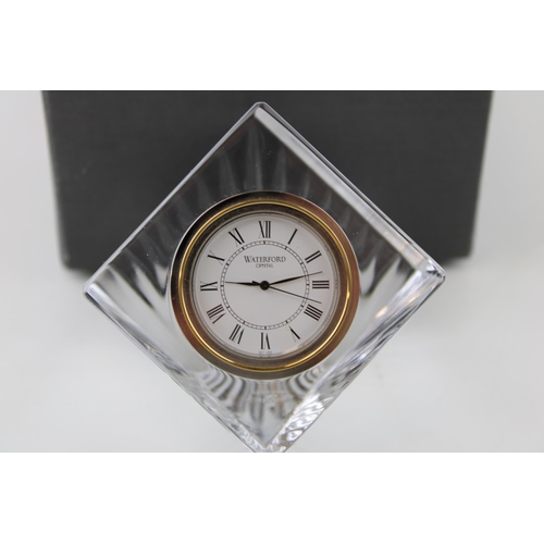 150 - A boxed Waterford Crystal desk clock. Quartz movement. Height 9.5cm.