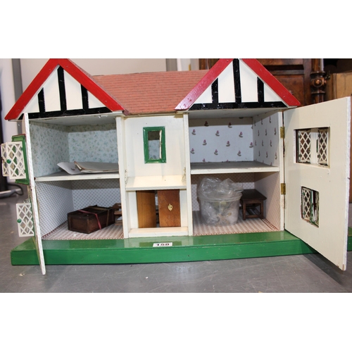 158 - A Triang vintage dolls house 'Honeysuckle Cottage' with a collection of furniture and miniature acce... 