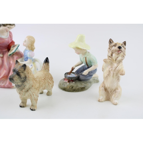 165 - A collection of Royal Doulton figures to include 'The Bedtime Story' HN 2059, 'River Boy' HN 2128 to... 