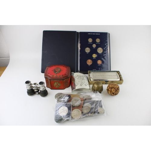 168 - A mixed collection of items to include commemorative crowns, Rolls Razor, vintage opera glasses, tin... 