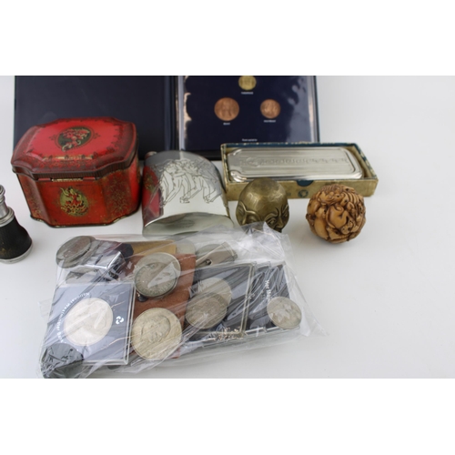 168 - A mixed collection of items to include commemorative crowns, Rolls Razor, vintage opera glasses, tin... 