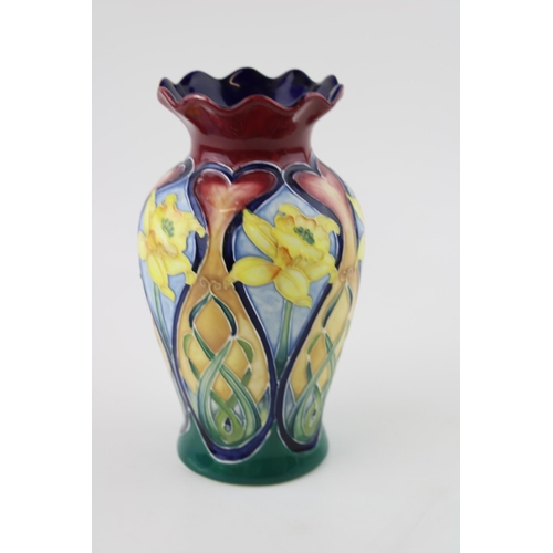 169 - An Old Tupton Ware vase hand painted by Jeanne McDougal. Daffodils design with tube lining.  Height ... 