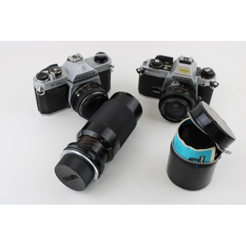 172 - A collection of vintage cameras and lenses to include a Pentax K1000 SLR, a Nikon FG - 20 together w... 