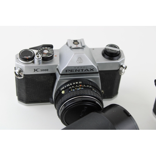 172 - A collection of vintage cameras and lenses to include a Pentax K1000 SLR, a Nikon FG - 20 together w... 