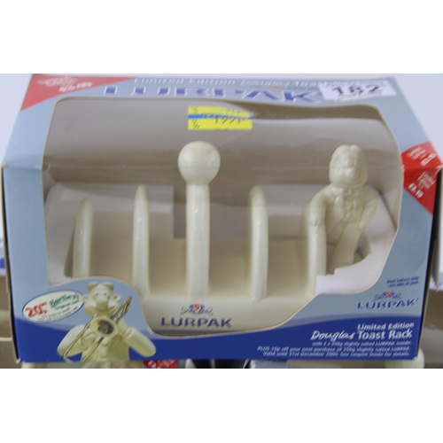 182 - Three 'Lurpak' advertising collectable ceramic toast racks in original packaging, Limited editions. ... 