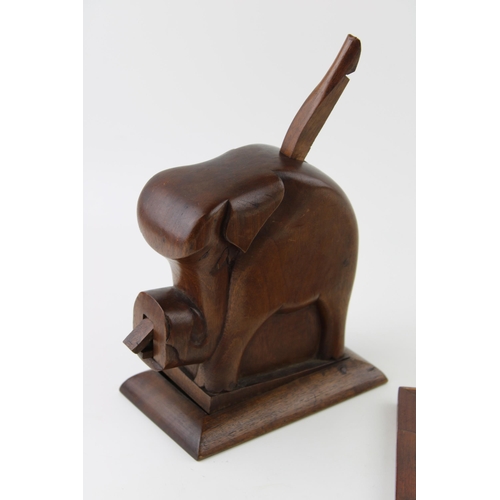 194 - A hand carved vintage wooden cigarette dispenser in the form of an elephant together with a vintage ... 