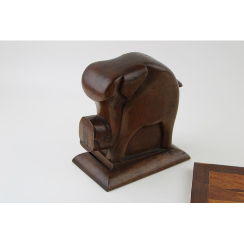 194 - A hand carved vintage wooden cigarette dispenser in the form of an elephant together with a vintage ... 