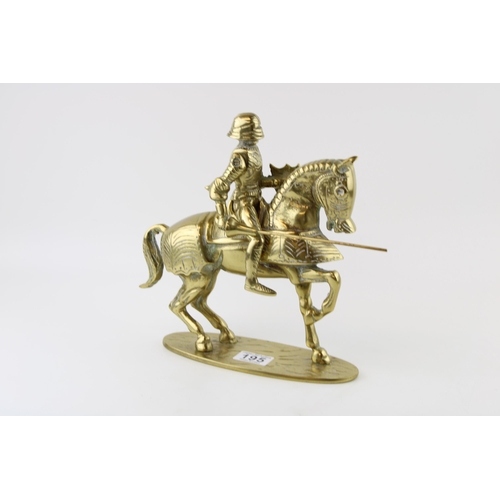 195 - A brass knight on horse back with articulated lance. Height 35cm. Weight 4.5kg