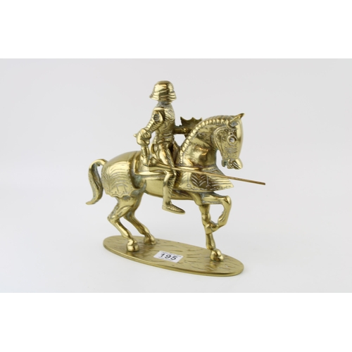 195 - A brass knight on horse back with articulated lance. Height 35cm. Weight 4.5kg