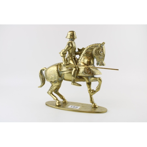 195 - A brass knight on horse back with articulated lance. Height 35cm. Weight 4.5kg