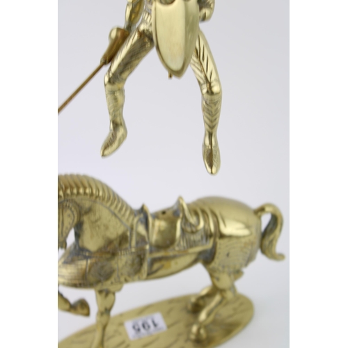 195 - A brass knight on horse back with articulated lance. Height 35cm. Weight 4.5kg