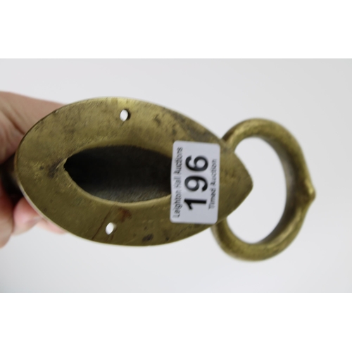 196 - A brass door knocker in the form of a horses head. Weight 1kg