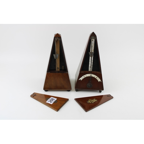 208 - Two wooden cased metronomes, 23cm tall (2).