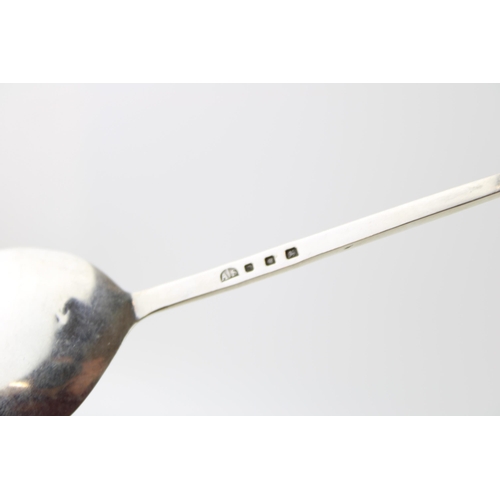 249 - Amy Sandheim: a silver spoon, Arts and Crafts form, London 1938, 31.0g, 15cm long.