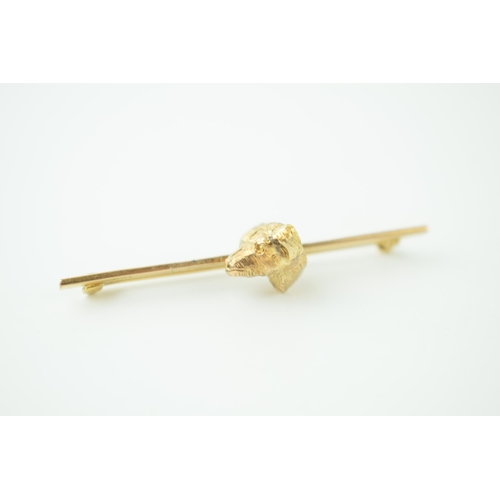 250 - 9ct gold bar brooch with gold dog's head, 5.3g, 52mm wide.