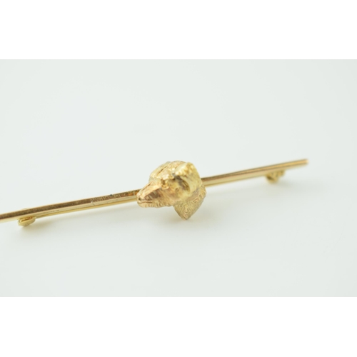 250 - 9ct gold bar brooch with gold dog's head, 5.3g, 52mm wide.