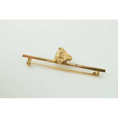 250 - 9ct gold bar brooch with gold dog's head, 5.3g, 52mm wide.