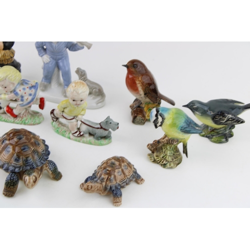 101 - A mixed collection of ceramics to include Goebel Chimney Sweep, Beswick Birds (3) Wade Ceramics and ... 