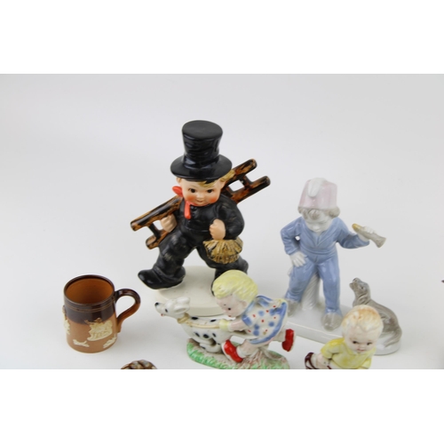 101 - A mixed collection of ceramics to include Goebel Chimney Sweep, Beswick Birds (3) Wade Ceramics and ... 