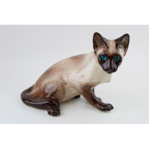 118 - Winstanley pottery Siamese cat, 28cm wide.