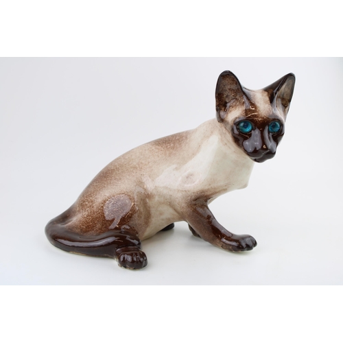 118 - Winstanley pottery Siamese cat, 28cm wide.