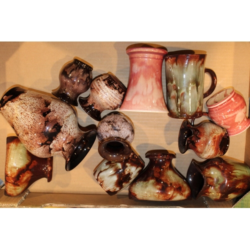 125 - A collection of Ewenny Pottery, in various colours and shapes, tallest 13cm.