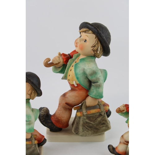 129 - Goebel graduated set of three figures of the Merry Wanderer, tallest 25cm (3).