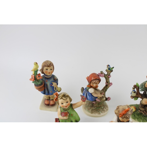 130 - A collection of Goebel figures to include An Apple A Day, Boy with Ladders, Friends, Girl with Flowe... 