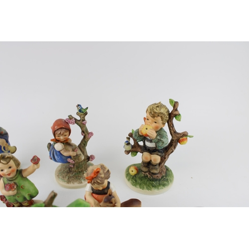 130 - A collection of Goebel figures to include An Apple A Day, Boy with Ladders, Friends, Girl with Flowe... 