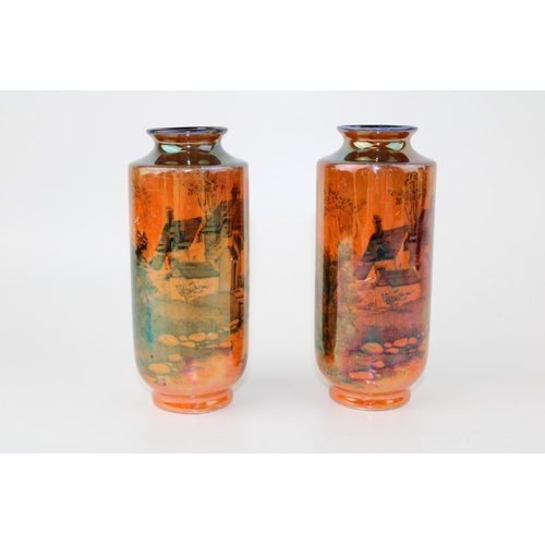 142 - A pair of Shelley lustre vases of cottage scenes, '793 8676' to base, 13cm tall (2).