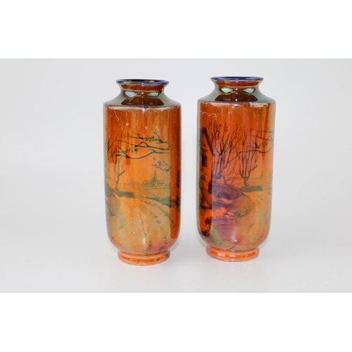 142 - A pair of Shelley lustre vases of cottage scenes, '793 8676' to base, 13cm tall (2).