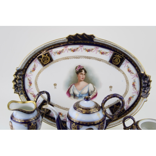 145 - A porcelain tea for two set, Crown above 'N' monogram, believed Sevres, to include coffee pot, two c... 