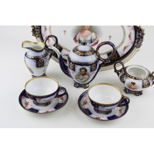 145 - A porcelain tea for two set, Crown above 'N' monogram, believed Sevres, to include coffee pot, two c... 