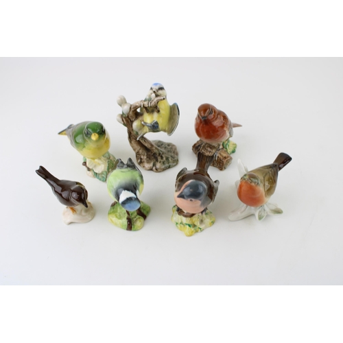 159 - A collection of Beswick, W Goebel and similar manufactures birds. To include Blue Tit, Robin, Greenf... 