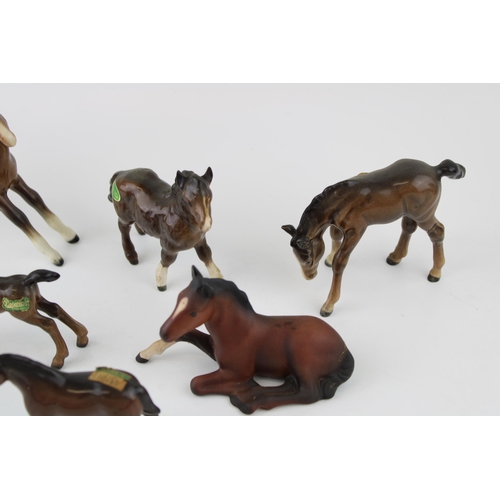 173 - Beswick to include brown foals such as a brown matte brown 915 lying foal, a Shetland foal and other... 