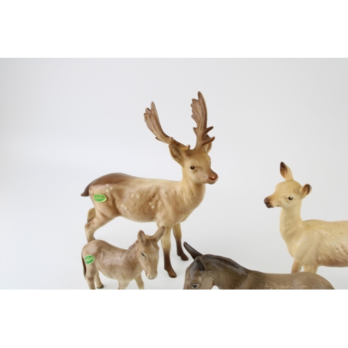 176 - Beswick animals to include a doe, a stag, a large donkey and a smaller donkey (4).