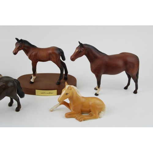 178 - Beswick foals to include a palomino flying foal 915,a Springtime on base, Adventure and two others (... 