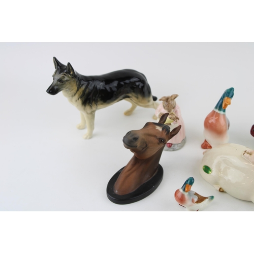 185 - Beswick to include an Alsatian, a horse head wall plaque, piggy back and others to include a Doulton... 