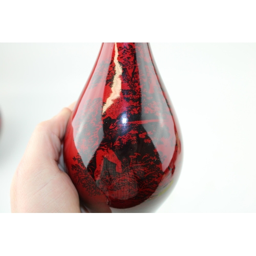 207 - Royal Doulton Flambe bottle vase Woodcut 1612. Decorated with a scene of man hunting with dog in a c... 