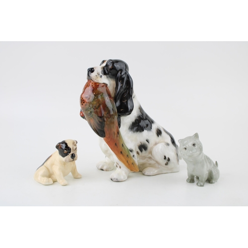 218 - Royal Doulton dogs to include a Cairn Terrier K11 in unusual light colourway, a Bulldog K3 and a Spa... 