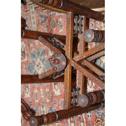 184 - A vintage middle eastern hand carved occasional table with mother of pearl inlay and heavy copper to... 