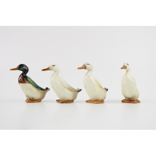 253 - A collection of Royal Doulton small ducks, painted in naturalistic colours, 6cm tall, to include thr... 