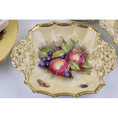 278 - A collection of Aynsley Orchard Gold, all signed D Jones, to include a dinner plates, pin dishes, a ... 