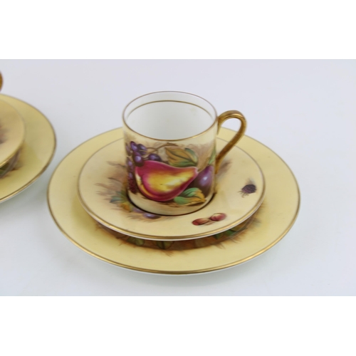 282 - Two Aynsley Orchard Gold coffee cans with saucers and side plates (6), 4 pieces signed D Jones.