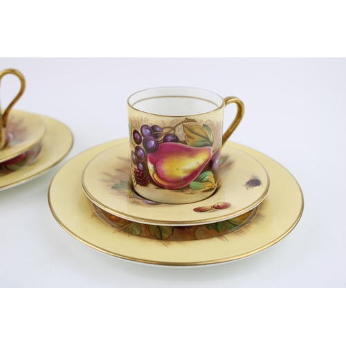 282 - Two Aynsley Orchard Gold coffee cans with saucers and side plates (6), 4 pieces signed D Jones.