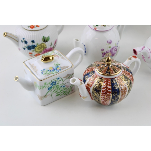 299 - A collection of Franklin Mint Victoria & Albert small teapots to include Meissen, Mennecy, Furstenbu... 